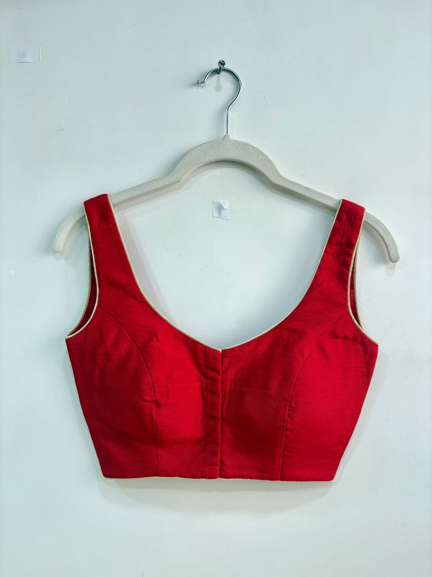 INTENSE RED SLEEVELESS BLOUSE WITH PADS